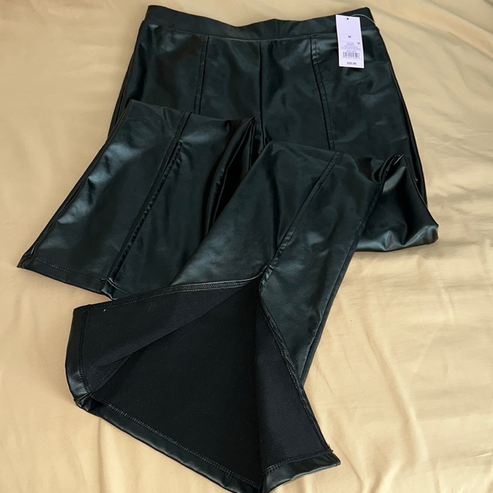 Women’s slit front faux leather flare pants
